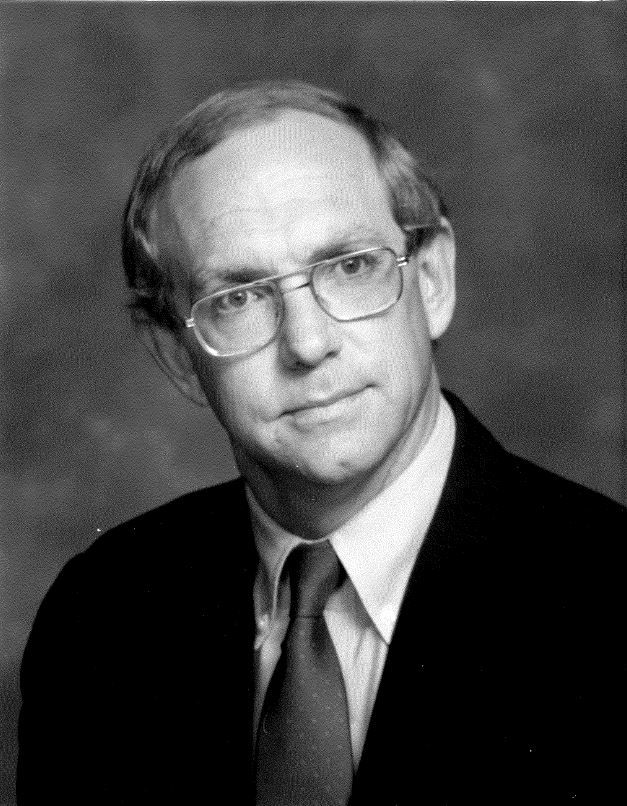 Professional headshot of Mitch Oakley