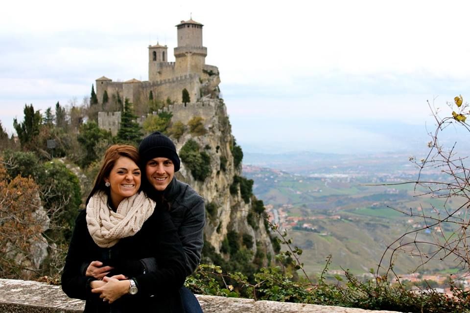 Ashlee with her husband in front of a castle